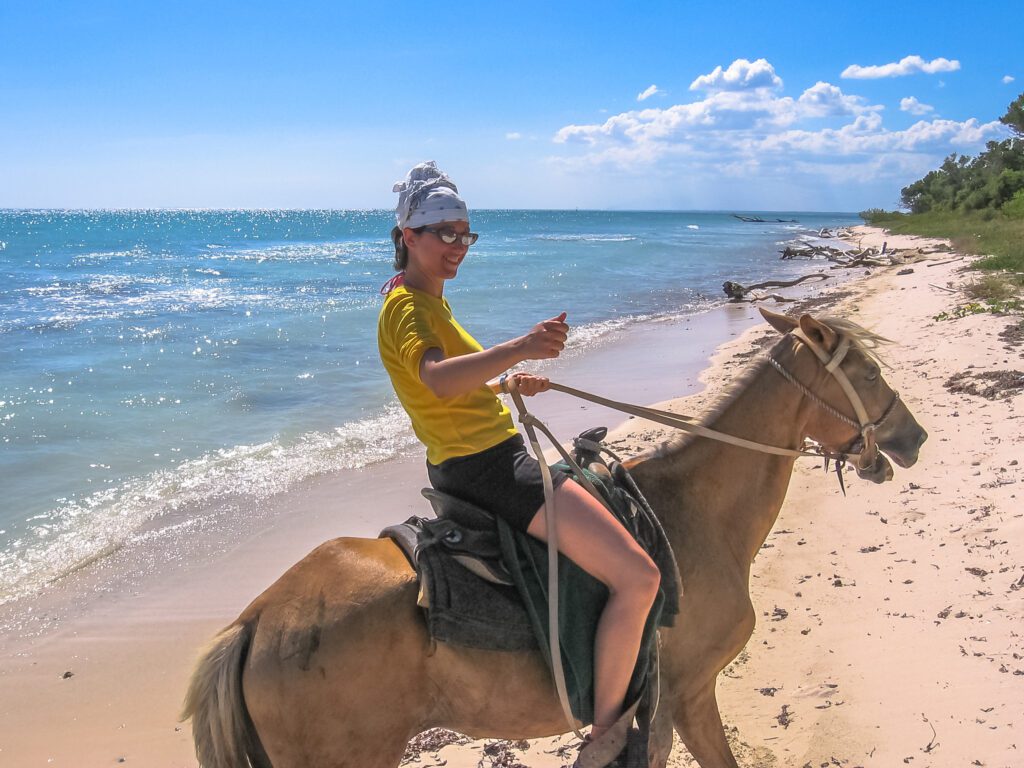 woman enjoying a ride infographics about horseback riding punta cana costumes along the DR beaches