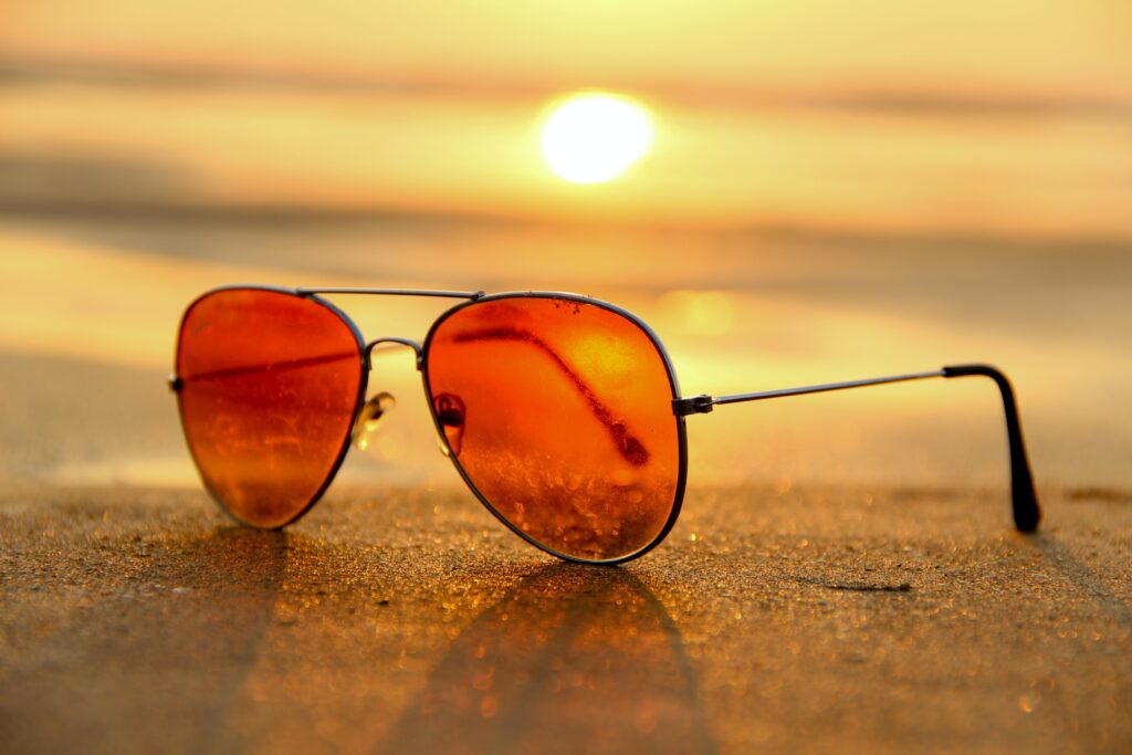 sun glasses on sand detail