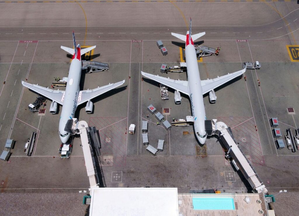 top view of tow airliners parked at airport