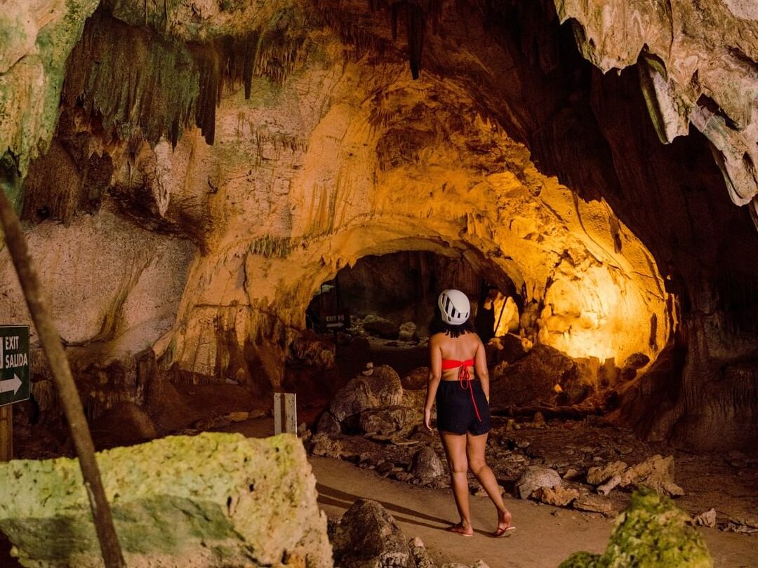 woman entering to explore the caves of Iguabonita
